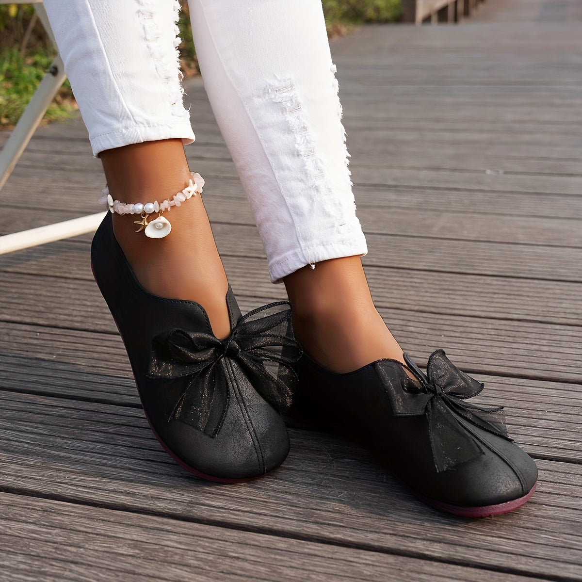 Mocassins à bride en noir, vue de face